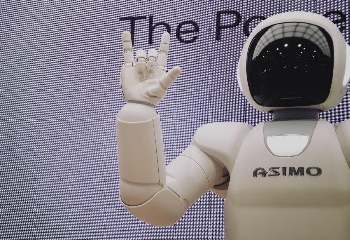 Asimo robot doing handsign